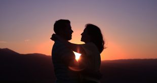 silhouette of hugging couple